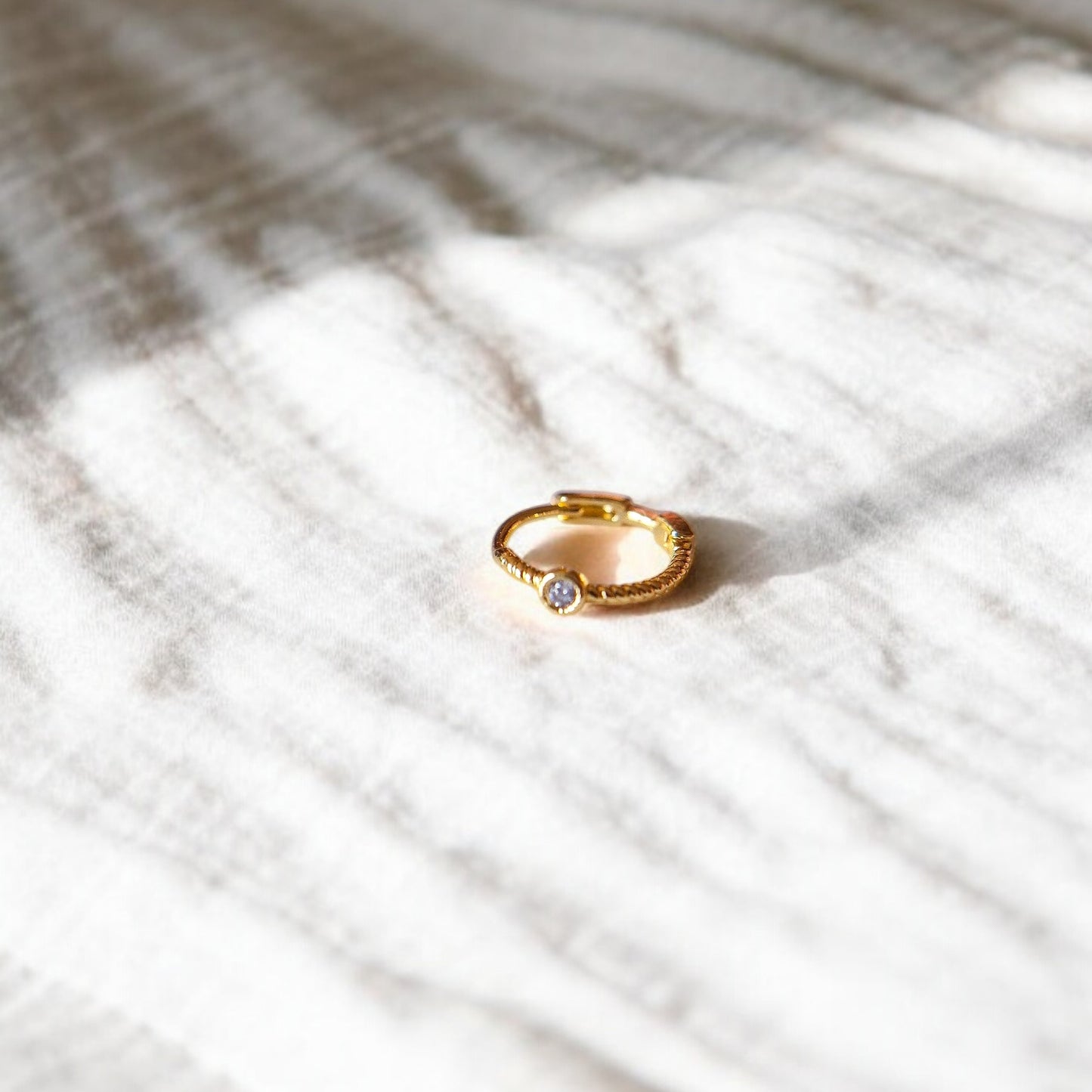 Spirale con punto luce oro