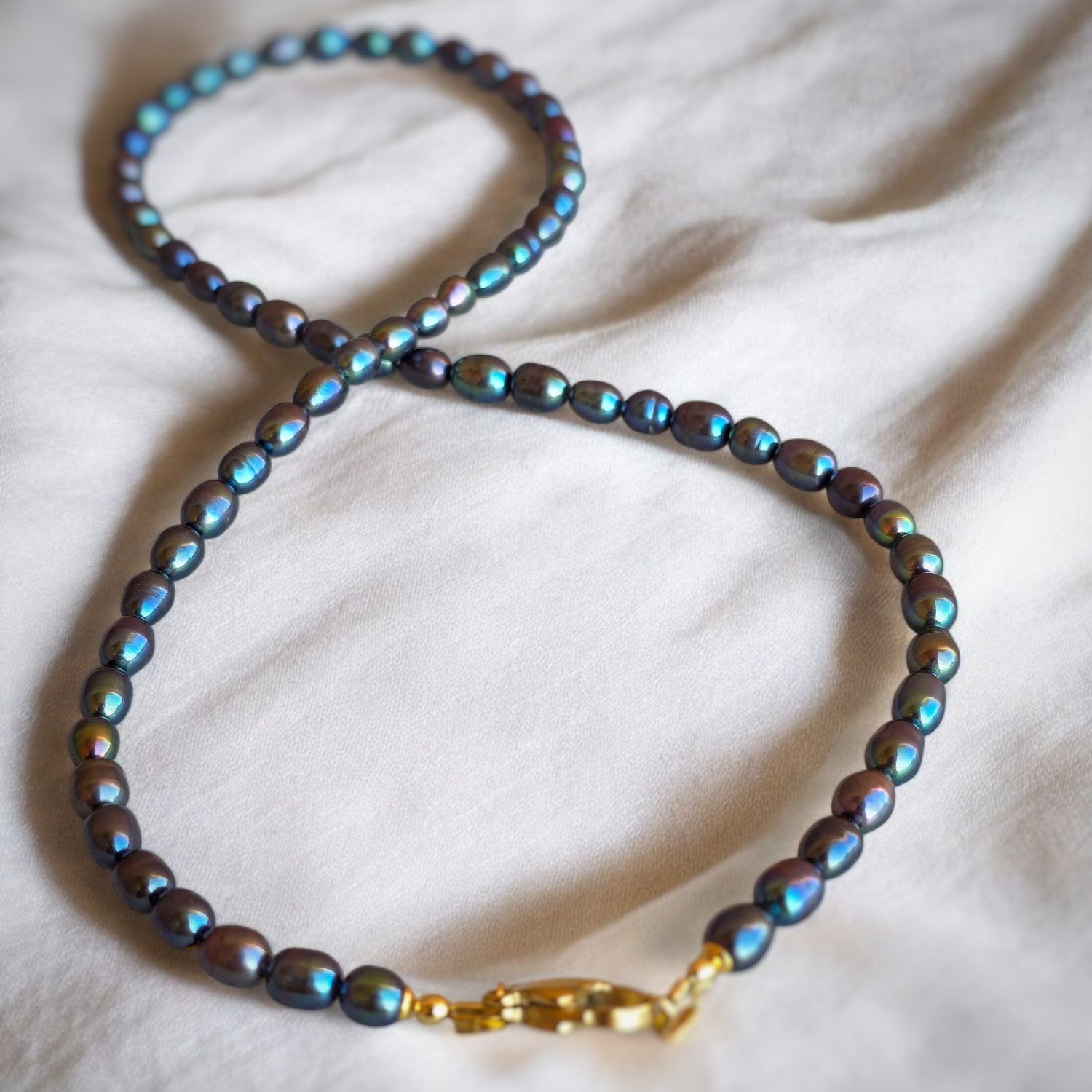 Perle di fiume nero-blu